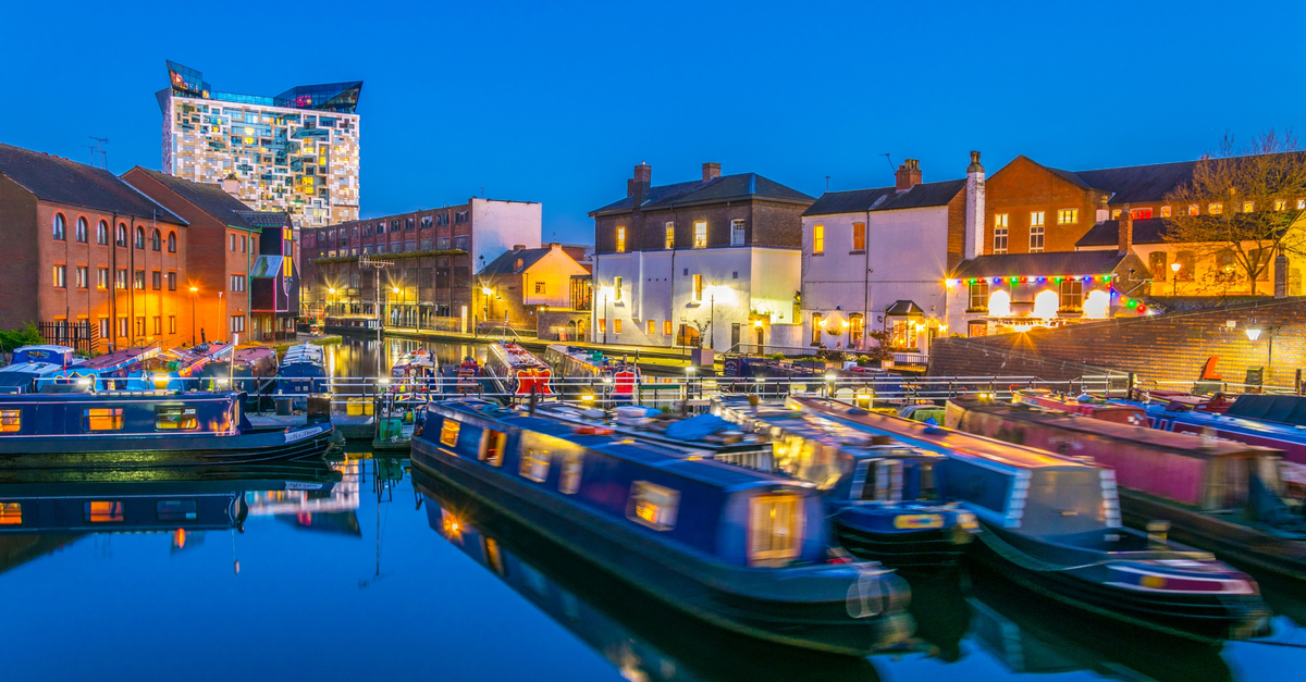 Birmingham: View of the famous Cube behind brick buildings.