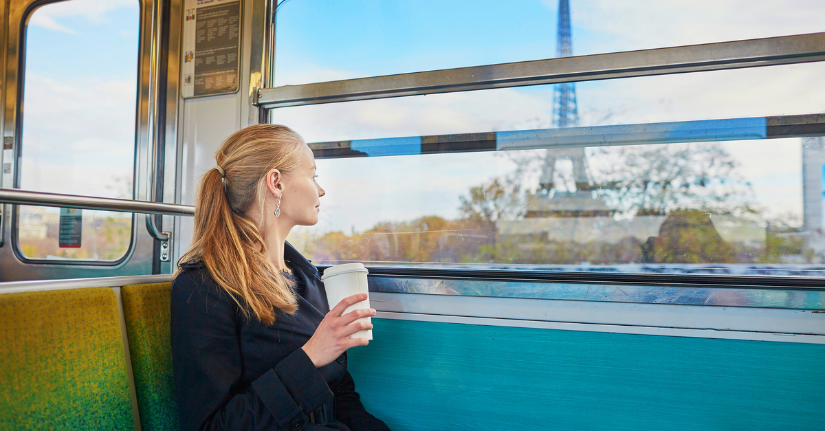 Woman on a train admiring the Eiffel Tower in Paris